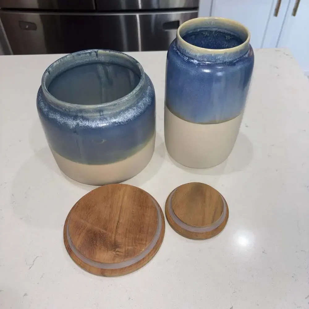 Set of 2 World Market Blue and Cream Ceramic Canisters Wooden Lids